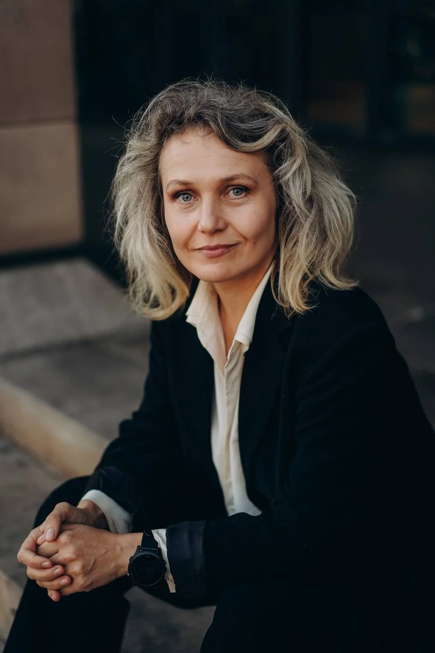 Yev Lukash speaking on stage in editorial portrait